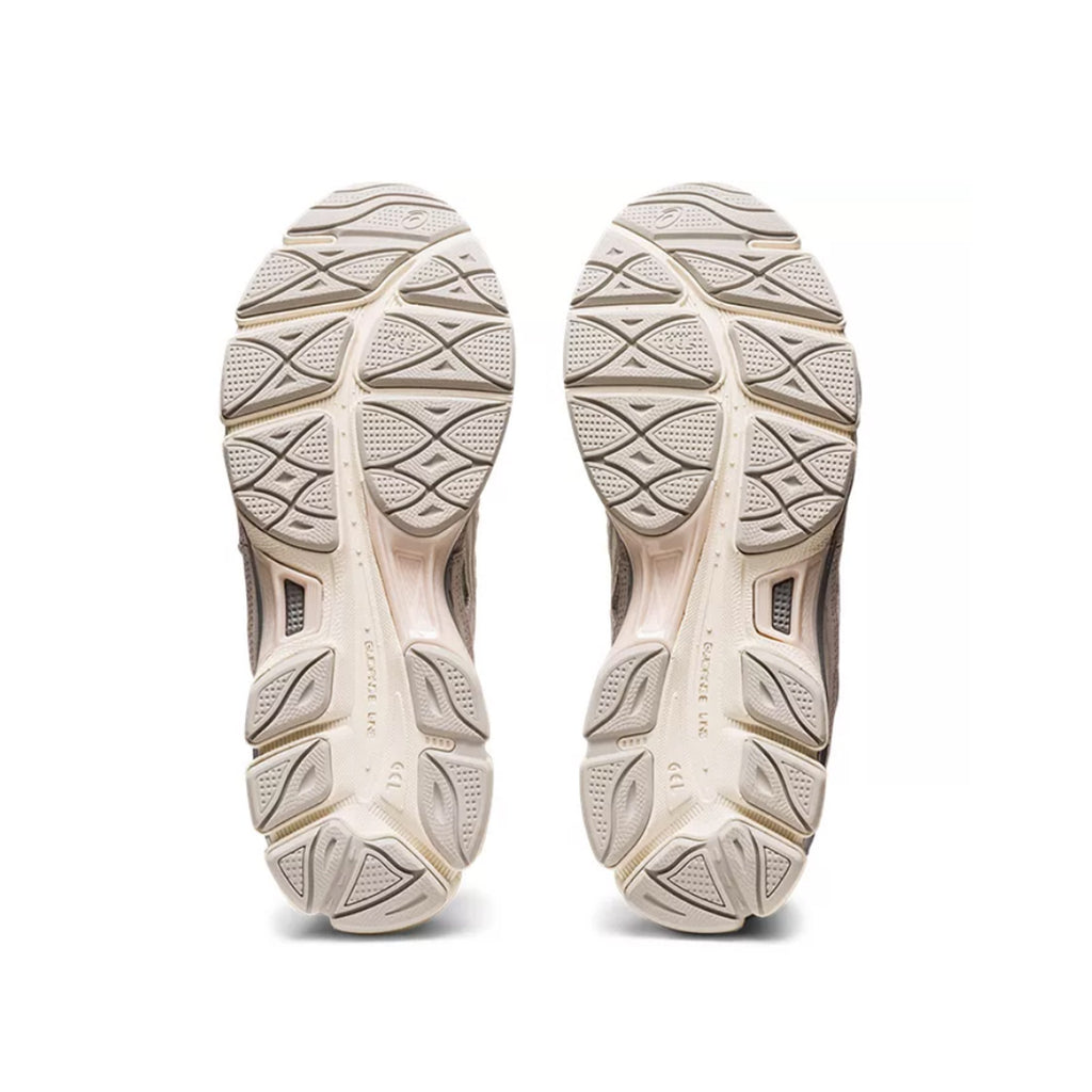 Outsole view of Asics Gel-NYC sneakers in cream and oyster grey with retro design and Gel cushioning