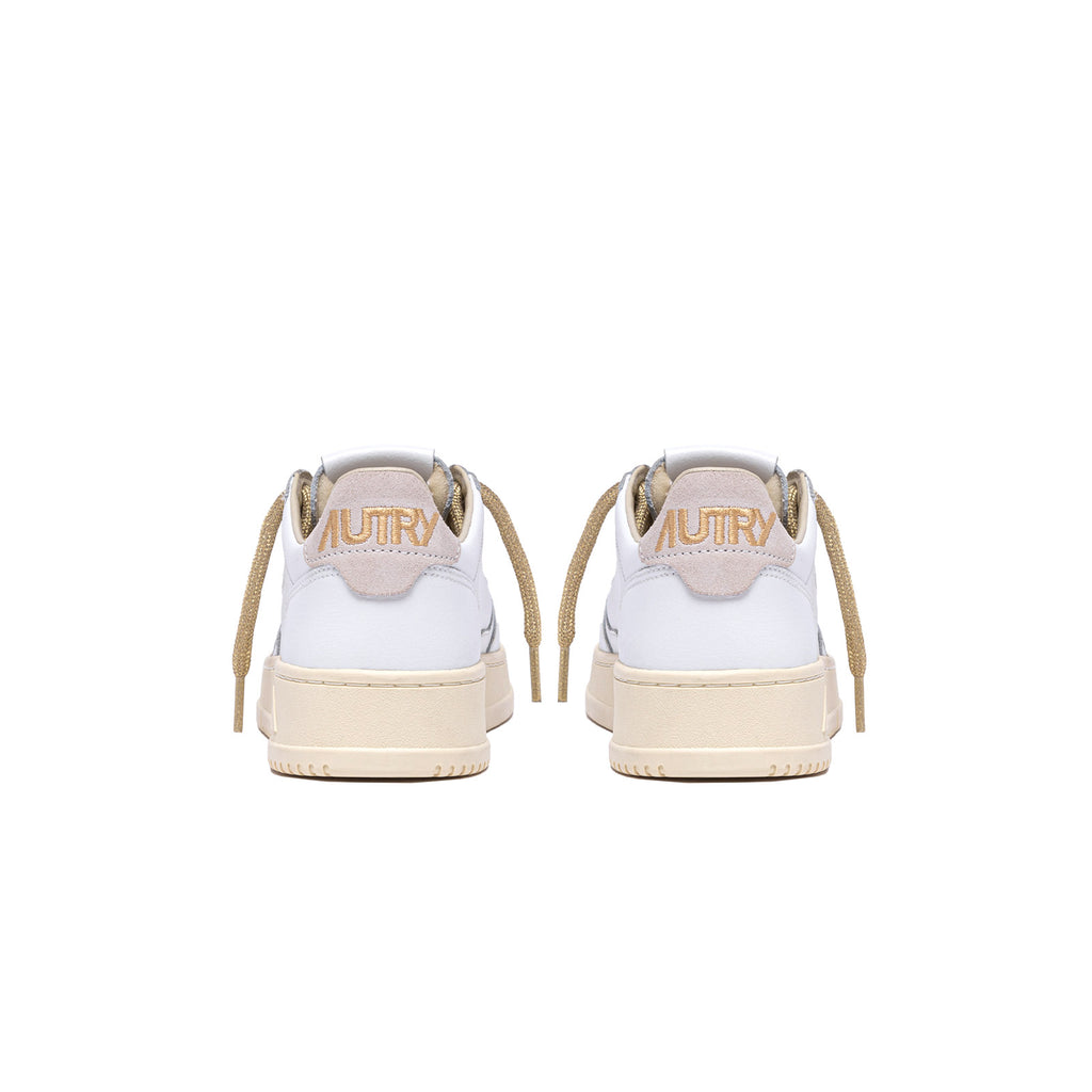 sneakers autry medalist blanches et dorées femmes vue de l'arrière
