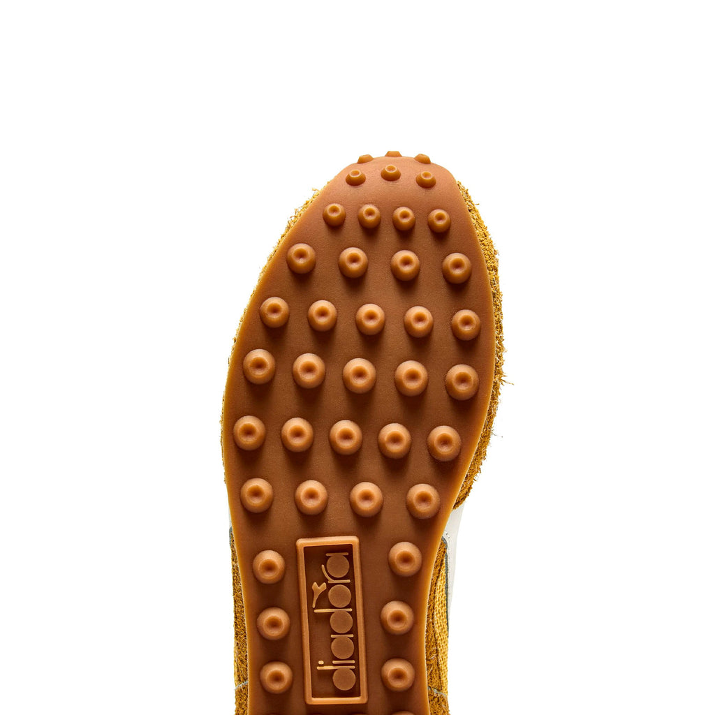  Outsole view of Diadora Rally Yellow sneakers highlighting bold traction and sporty design